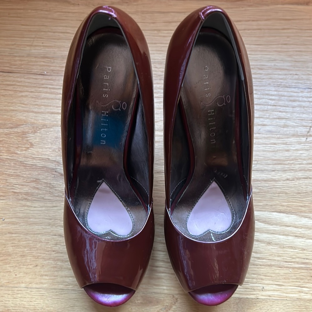 Paris Hilton 4 inch platform in patent plum. Very pretty shoes with pink soles.